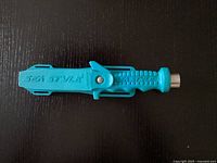 Sea Style scuba diving knife sheath closed, showing the blue plastic sheath with Sea Style logo.