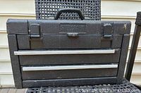 Closed view of the Steelcraft toolbox showing black textured exterior, metal latches, and handle.