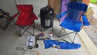 Full lot with grill, chairs, grill accessories, and smoker components on the floor