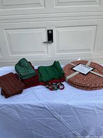 Lot overview showing placemats, napkins, napkin rings