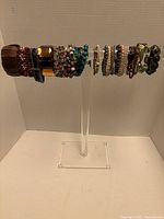 Bracelets displayed on clear stand