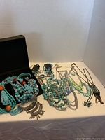 Entire lot showing blue jewellery spread with box open