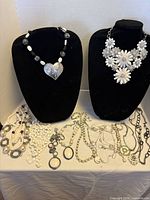 Entire assortment displayed on busts and table