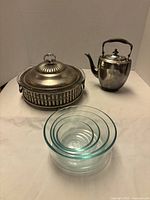 All items grouped: casserole with lid, teapot, nested bowls