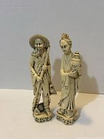 Front view of both figurines showing design and scale