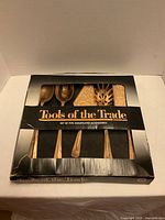 Boxed 5-piece gold-plated flatware set front view