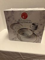 Box showing The Luxury Collection by Tastemilieu with images of plate, bowl and mug