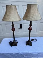Both lamps side by side with shades and cords visible