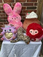 Group view of all five plush toys