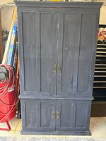 Full front view showing armoire design, size and finish