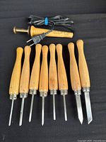 All eight chisels and transfer tool front view