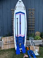 Full view of Rangalii paddleboard with paddle, pump, box, accessories