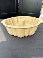 Exterior side view of stoneware Bundt pan