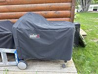 Grill covered with Weber fabric cover