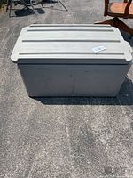 Photo of the full insulated plastic tote closed with lid visible, showing size and overall condition.