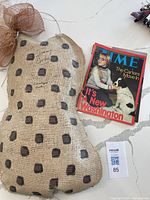 Time magazine featuring The Carters on cover, signed by Jimmy Carter, placed beside peanut wall hanging.