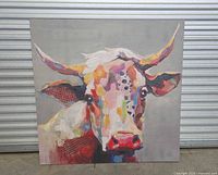 Full front view of the colorful cow painting on a gray background, showing the entire canvas and gallery wrap.