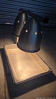 Photo showing the front view of the FEI commercial heat lamp with two aluminum conical lamps and rectangular drip tray beneath.