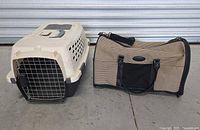 Photo showing two pet carriers placed side by side: a beige and black hard shell carrier and a soft-sided houndstooth fabric carrier.
