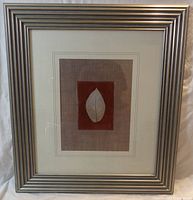 Full view of framed leaf artwork