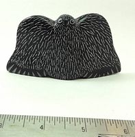 Front view of carved bird showing detail and scale