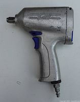 Left side view of Campbell Hausfeld TL1102 impact wrench showing CH logo, handle and air fitting