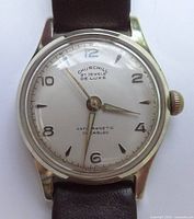 Front view of Churchill Deluxe watch showing dial and strap
