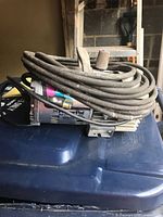 Side view of PowerPal portable air compressor showing brand label and power cord wrapped around the unit.