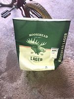 Front view of Moosehead Lager cooler bag with logo and 24-pack indicator