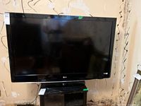 Front view of the LG 47-inch 47LH38 TV showing the screen and stand, black bezel.