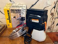 Wagner Power Painting System 315E main device with hose and power cord next to original box