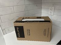 Sealed cardboard box of Equipe Carrera ceramic backsplash tile showing front and top with label and branding