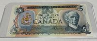Front view of the 1979 Canadian 5 Dollar bill showing Sir Wilfrid Laurier and the Bank of Canada crest.