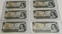Two sets of three Canadian one dollar bills from 1973, sequential and uncirculated, housed in clear holders.