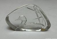Front angled view of the clear crystal duck sculpture with etched details and Signature Collection label.