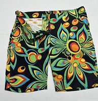 Back side of Loudmouth golf shorts showing same multi-colored floral pattern with belt loops and back pockets.