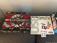 ATI All-In-Wonder 9600 box next to VST USB floppy drive box