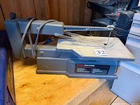 Full left-side view of Craftsman scroll saw showing table, arm, cord