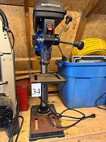 Full view of Mastercraft drill press showing base, column, table and chuck