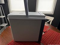 Side view showing overall cooler and carry handle