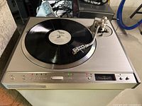 Full view of Pioneer PL-630 turntable with record and tonearm