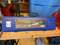 Closed blue plastic case with product label