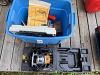 Router in case beside tote of parts