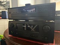 Front view of stacked Denon DVM-1800 player on top of AVR-1609 receiver