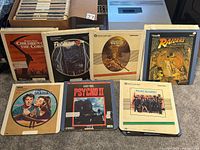 Front view of seven CED movie discs showing sample titles