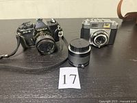 Front view of both cameras and separate telephoto lens