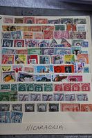 Full view of stock sheet labeled 'NICARAGUA' with multiple stamps in various colors featuring people, animals, and objects.