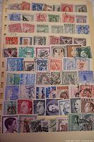 Photo showing a sheet of assorted used Greek stamps in various colors and denominations, arranged in rows on a stock sheet.