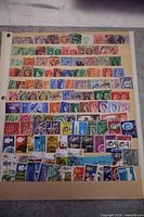 Four stock sheets of Great Britain stamps including mint and used, varied eras from early Victoria to modern, with multiple colors and denominations.