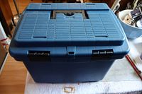 Closed blue plastic carrying/storage case for skill saw